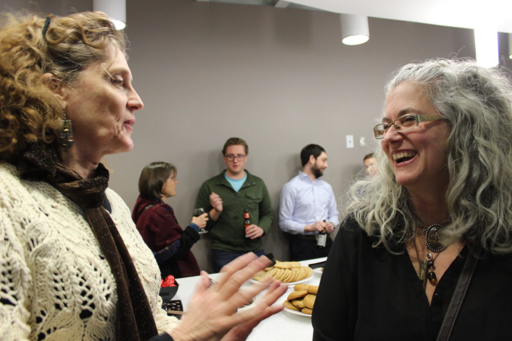 “Pictured left to right, Gail Philben, Director of the Sierra Club Michigan Chapter, talks with Kathleen Heideman of the Mining Action Group. Photograph provided by the Sierra Club Michigan Chapter.” Download this photo.